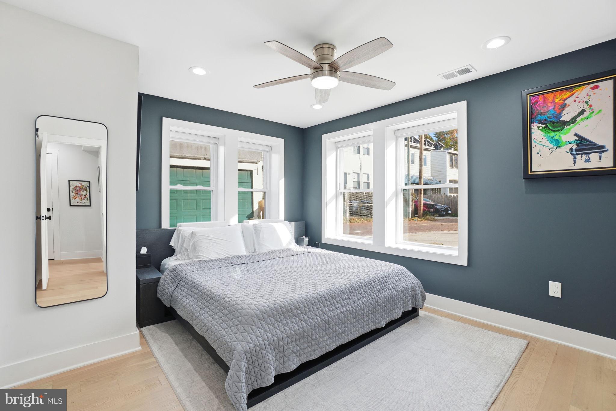 616 Quebec Place Northwest, Unit 1 Washington, DC 20010 - Photo 11 of 26 a bedroom with a bed and a large window