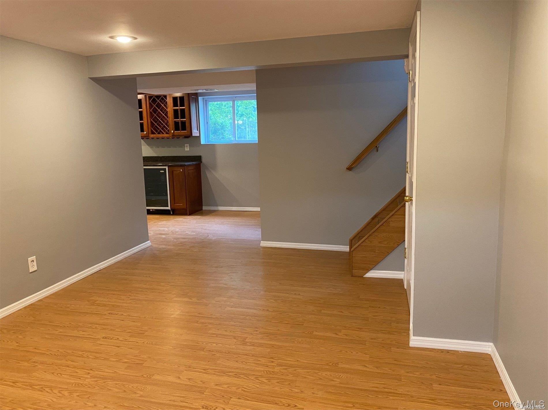 23 Duncan Lane Huntington, NY 11743 - Photo 14 of 25 a view of kitchen and hallway with wooden floor