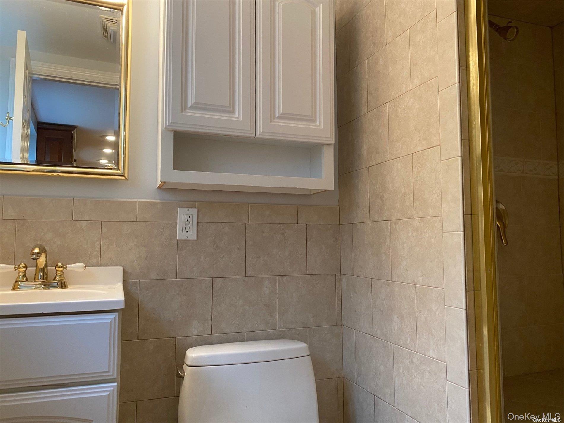 23 Duncan Lane Huntington, NY 11743 - Photo 18 of 25 a bathroom with a toilet and a sink