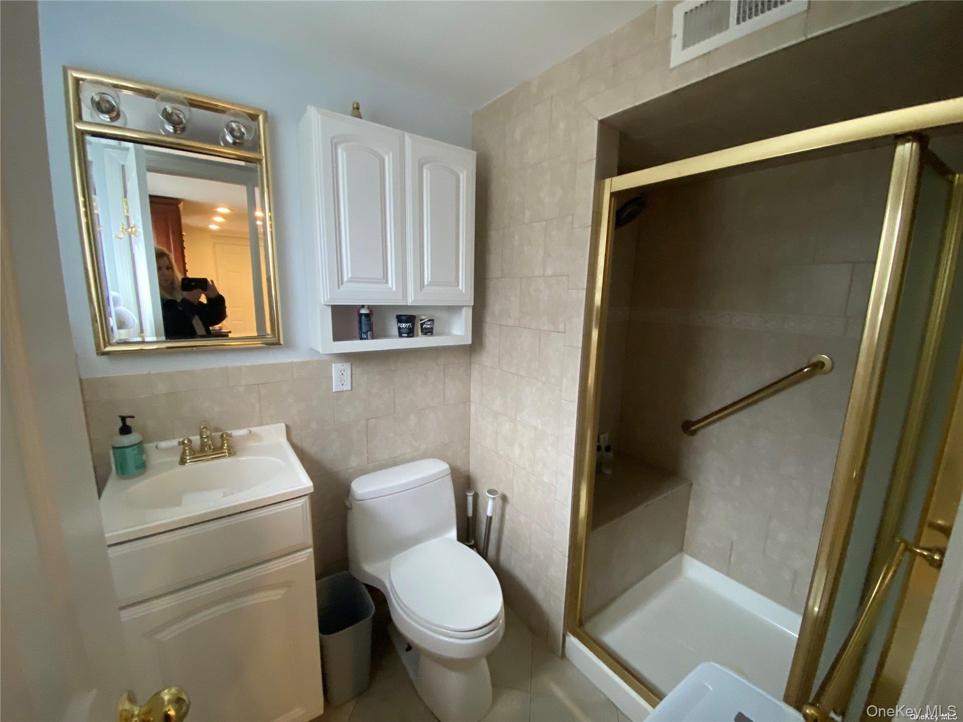 23 Duncan Lane Huntington, NY 11743 - Photo 19 of 25 a bathroom with a toilet sink and tub