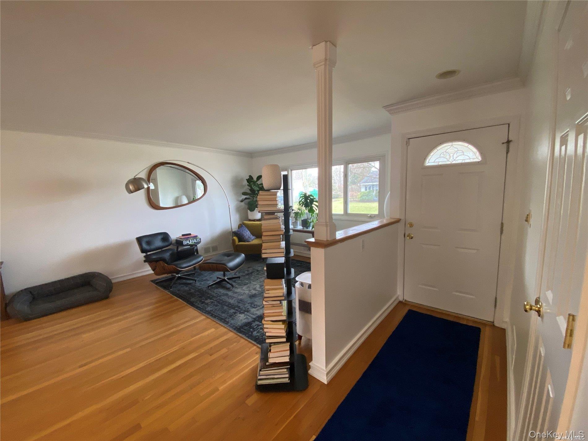 23 Duncan Lane Huntington, NY 11743 - Photo 2 of 25 a view of a room with wooden floor and furniture