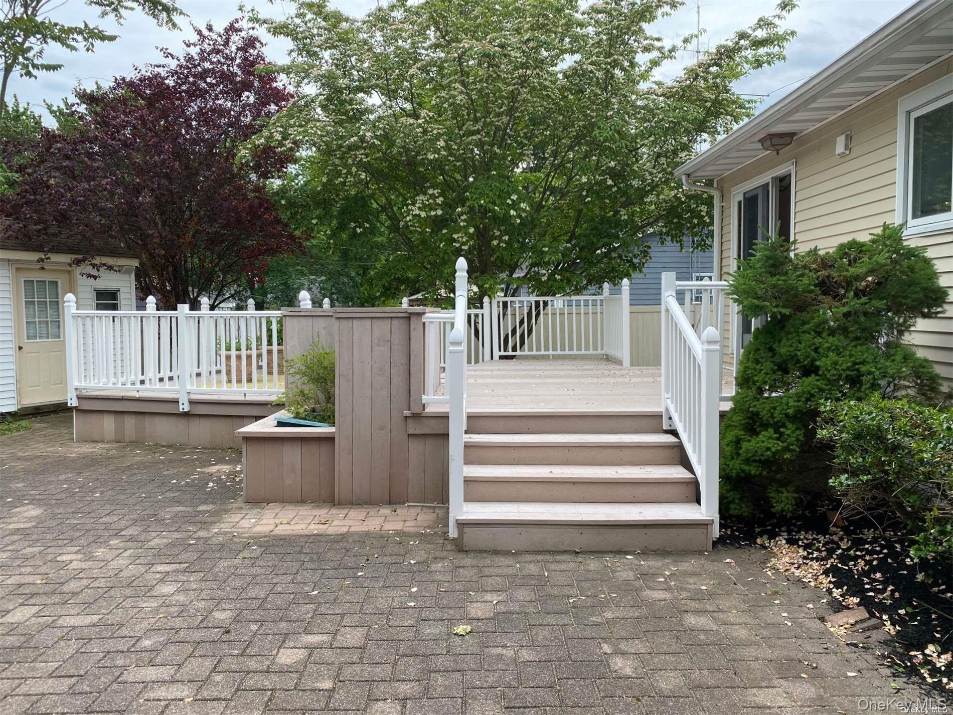 23 Duncan Lane Huntington, NY 11743 - Photo 23 of 25 a view of small house with white fence