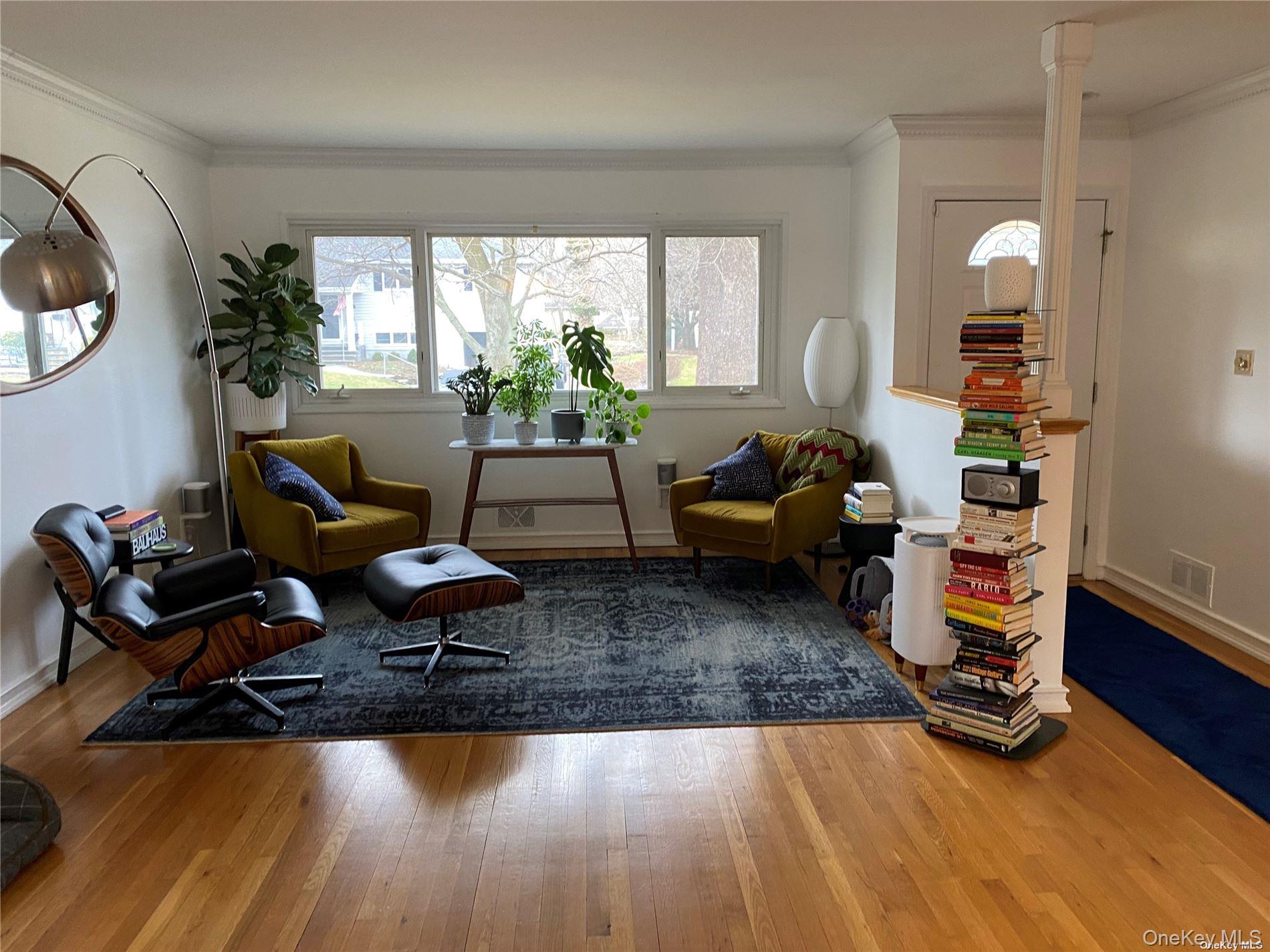 23 Duncan Lane Huntington, NY 11743 - Photo 3 of 25 a living room with furniture and a wooden floor