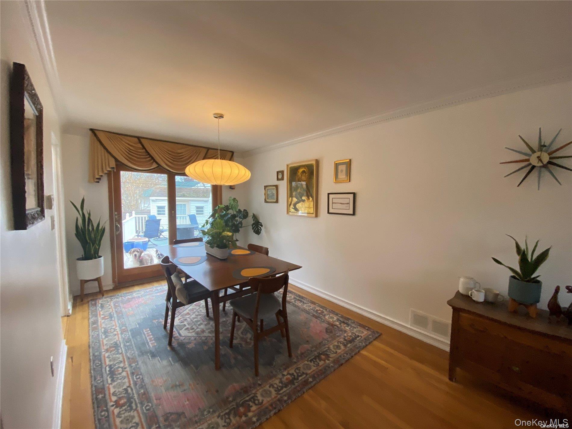 23 Duncan Lane Huntington, NY 11743 - Photo 5 of 25 a dining room with furniture and wooden floor