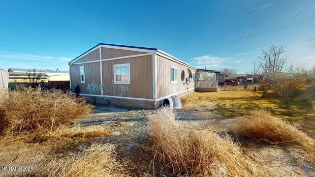a house view with swimming pool in front of it