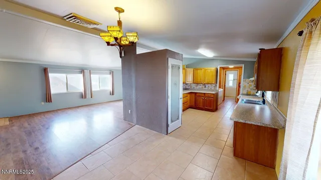 a lobby with furniture and chandelier