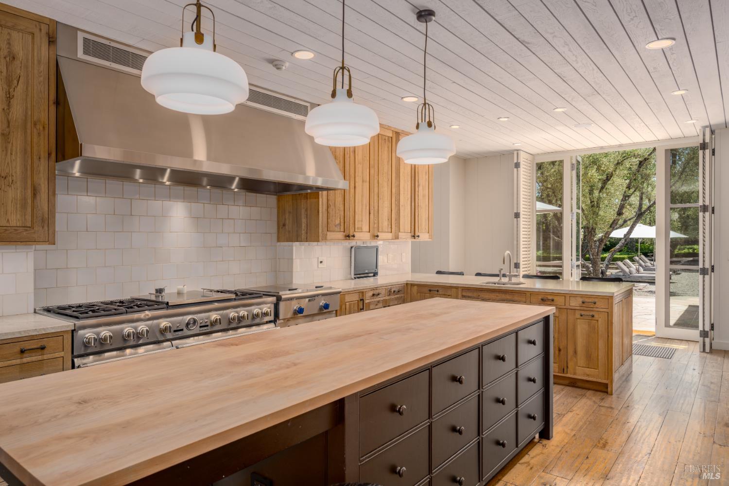 900 Rutherford Road St. Helena, CA 94574 - Photo 13 of 70 a kitchen that has a lot of cabinets in it