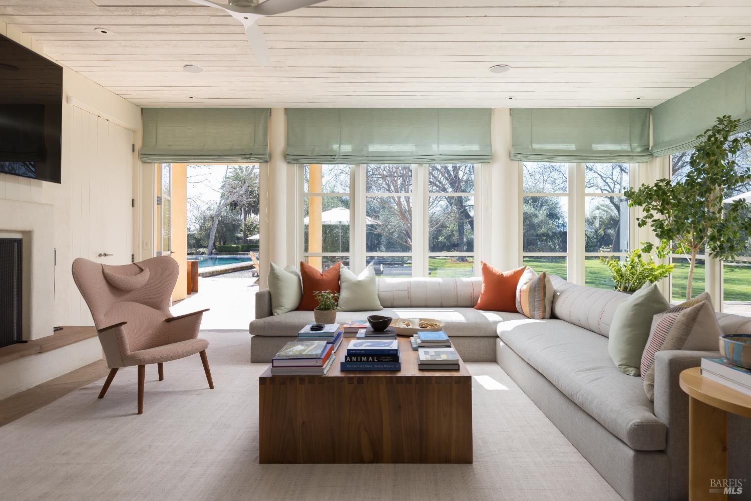 900 Rutherford Road St. Helena, CA 94574 - Photo 26 of 70 a living room with furniture and a flat screen tv
