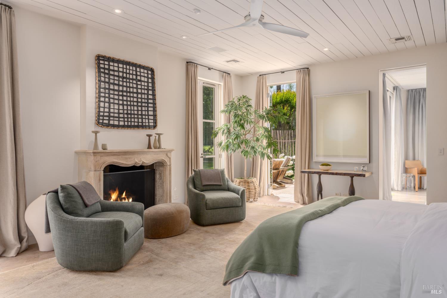 900 Rutherford Road St. Helena, CA 94574 - Photo 29 of 70 a bedroom with a bed and a fireplace