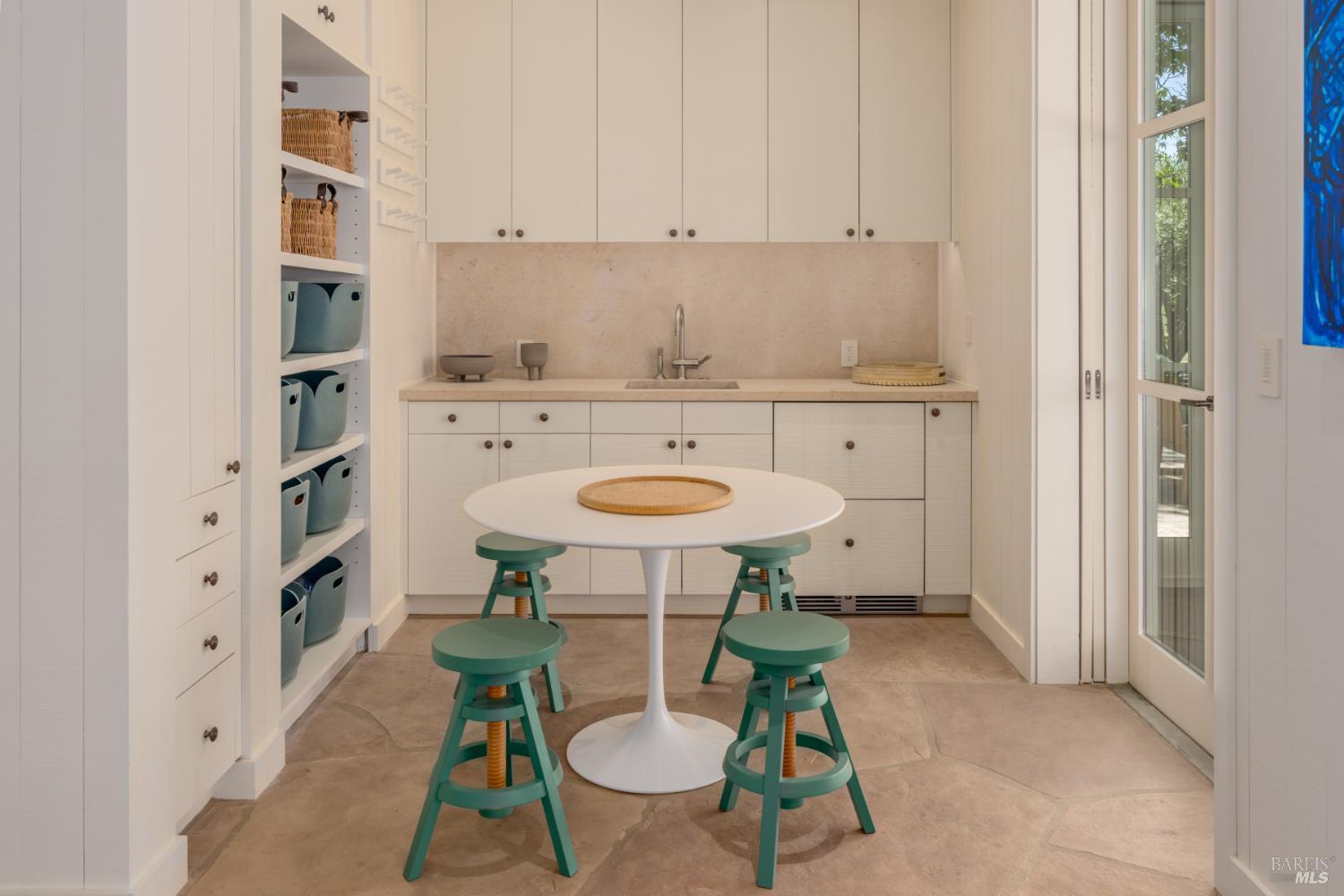 900 Rutherford Road St. Helena, CA 94574 - Photo 37 of 70 a kitchen with stainless steel appliances a white table chairs and a refrigerator