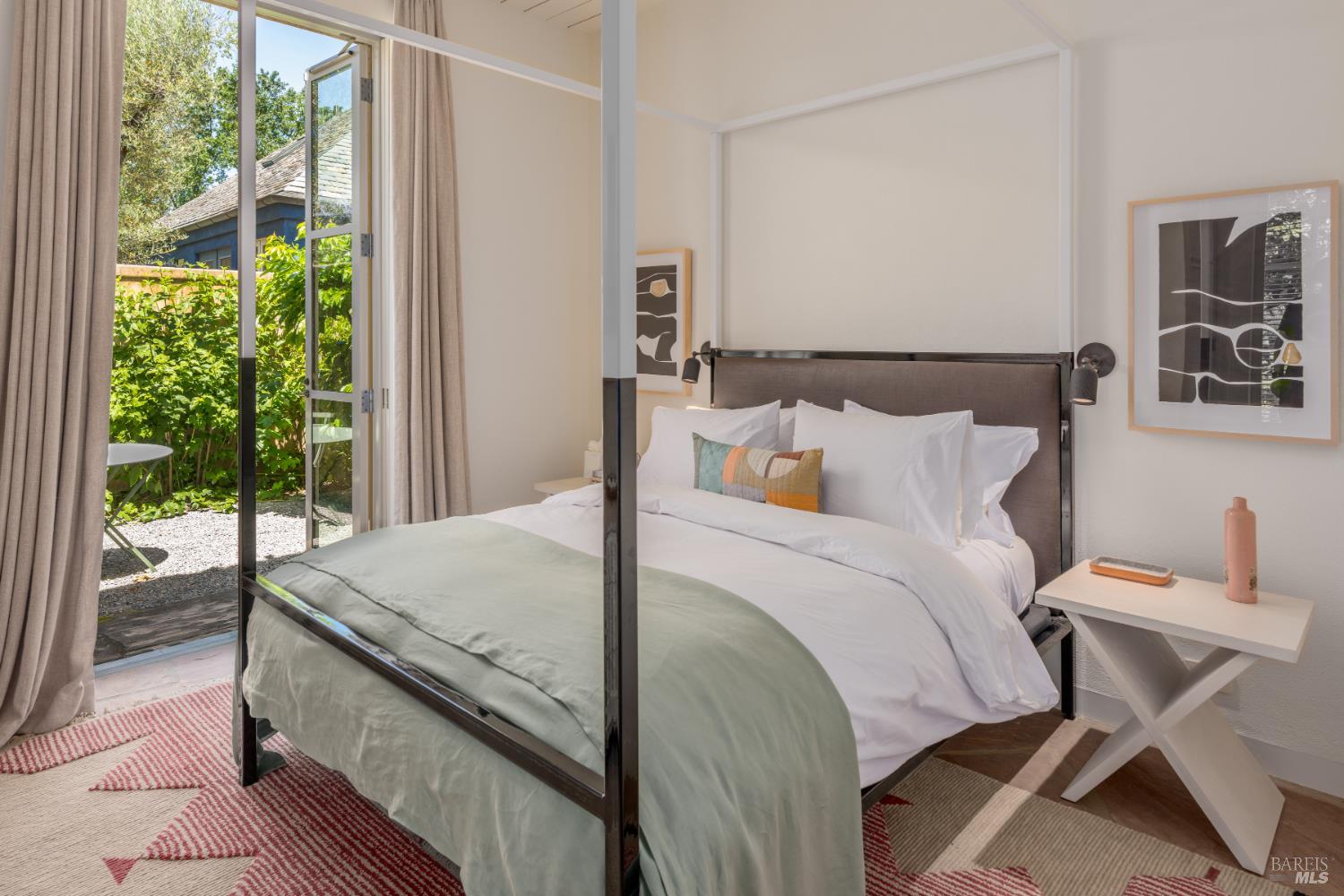 900 Rutherford Road St. Helena, CA 94574 - Photo 39 of 70 a bedroom with a bed and balcony view