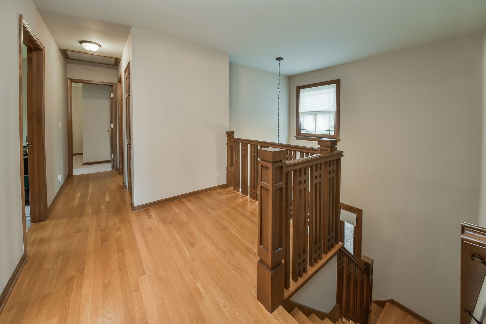 220 Aldrin Avenue Batavia, IL 60510 - Photo 11 of 23 a view of a hallway with wooden floor