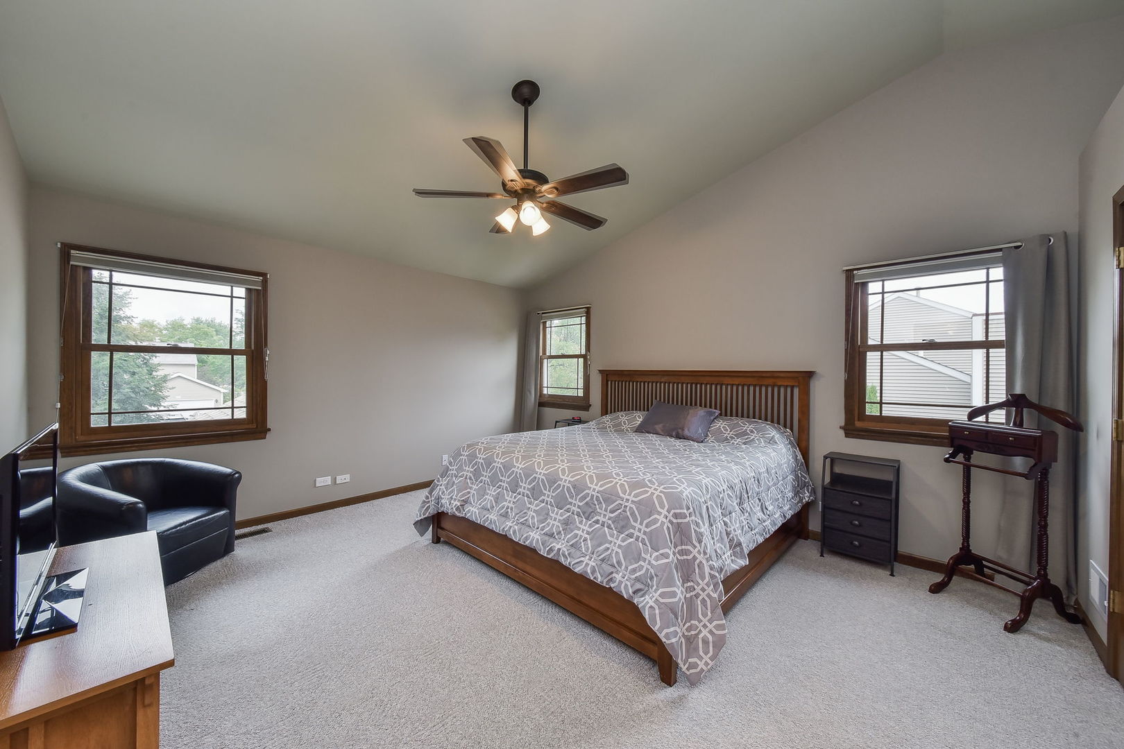 220 Aldrin Avenue Batavia, IL 60510 - Photo 12 of 23 a bedroom with a bed and a chandelier