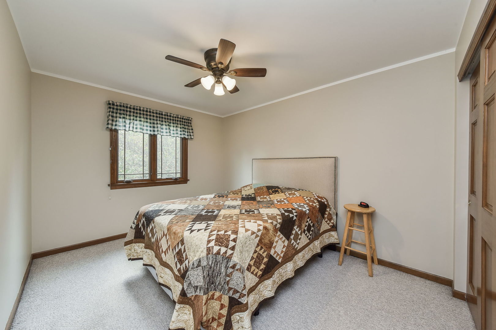 220 Aldrin Avenue Batavia, IL 60510 - Photo 15 of 23 a bed sitting in a bedroom next to a window