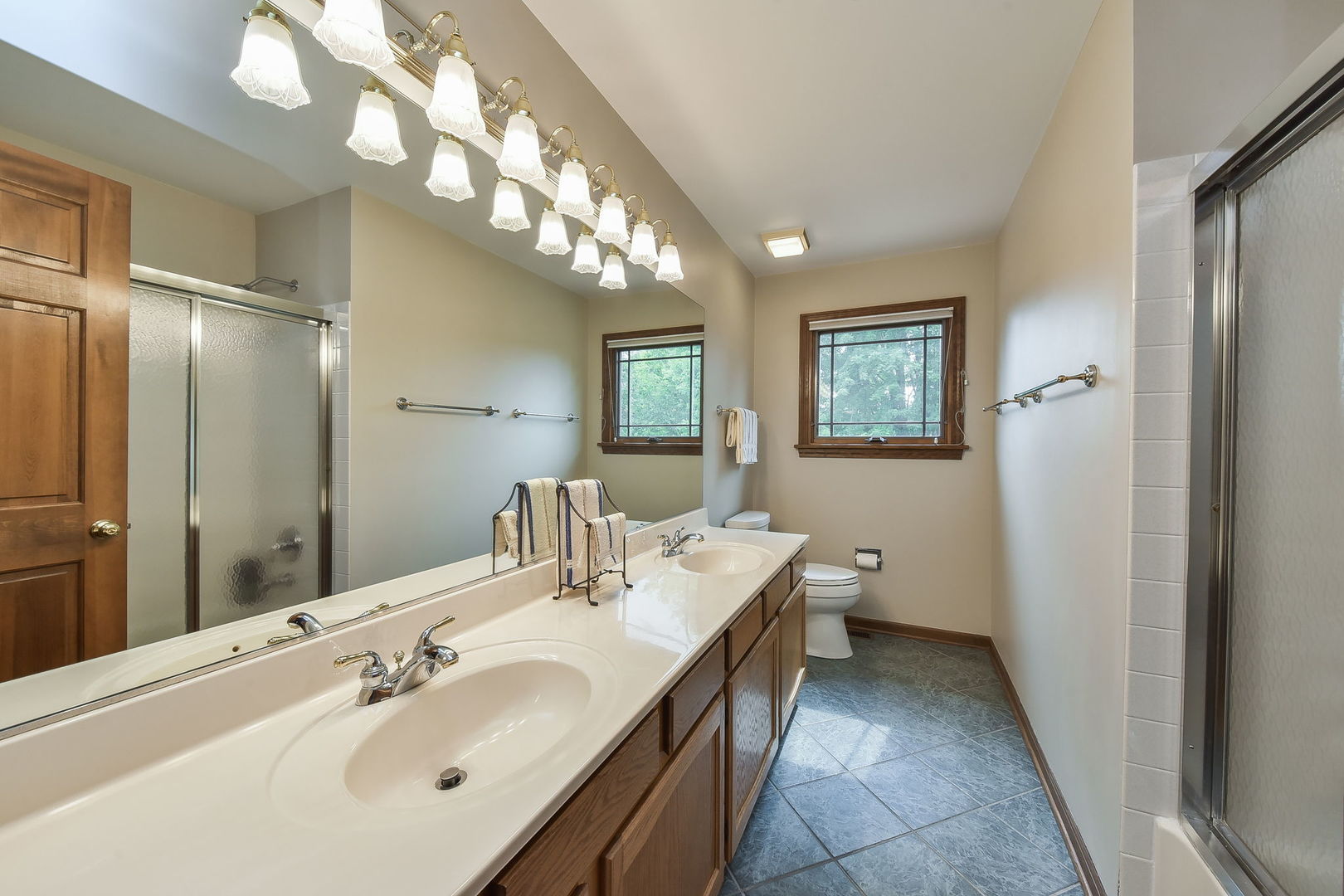 220 Aldrin Avenue Batavia, IL 60510 - Photo 17 of 23 a spacious bathroom with a double vanity sink and a mirror