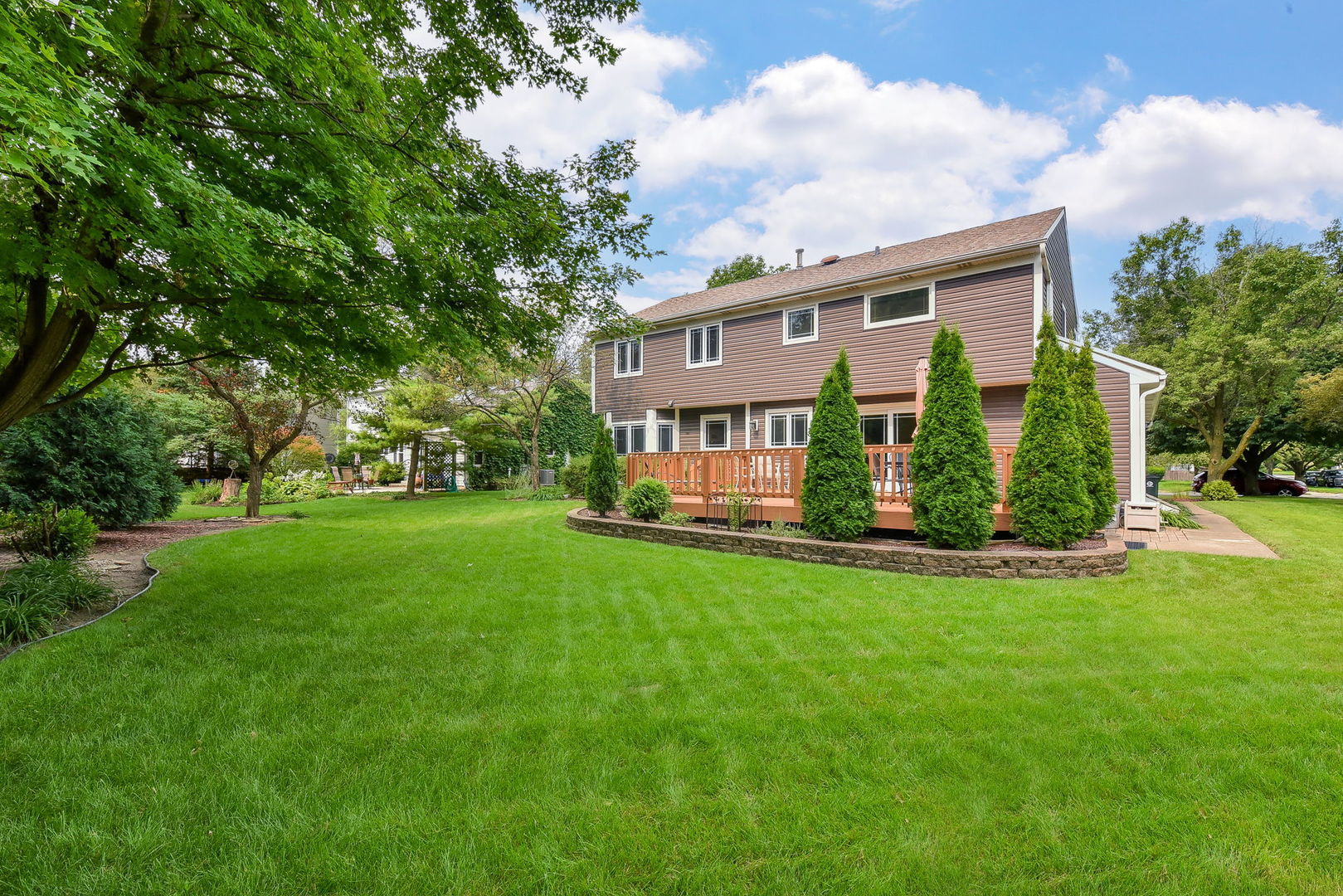220 Aldrin Avenue Batavia, IL 60510 - Photo 23 of 23 a view of house with a big yard and large trees
