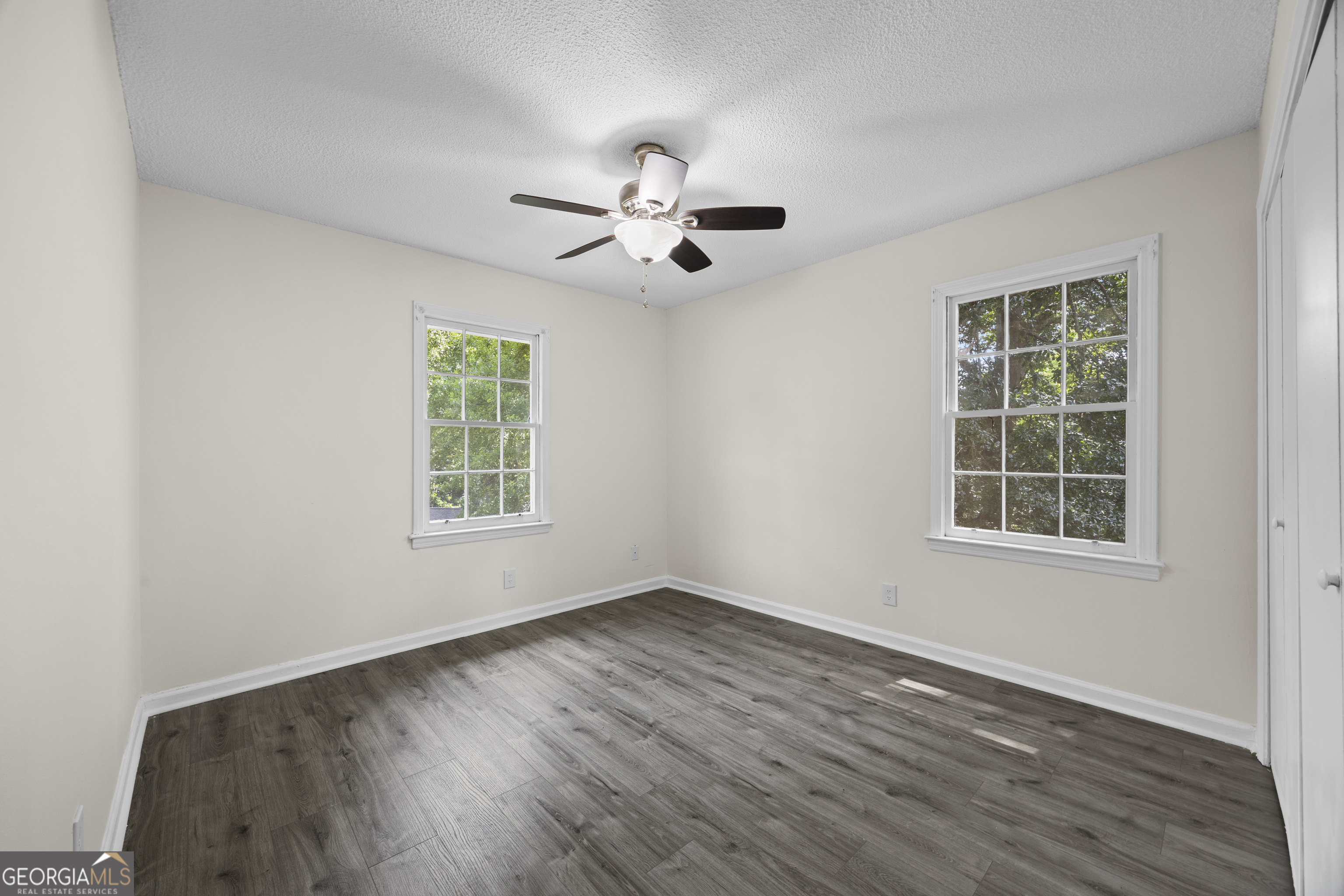 135 Hill Street, Unit 22 Decatur, GA 30030 - Photo 17 of 36 wooden floor in an empty room with a window