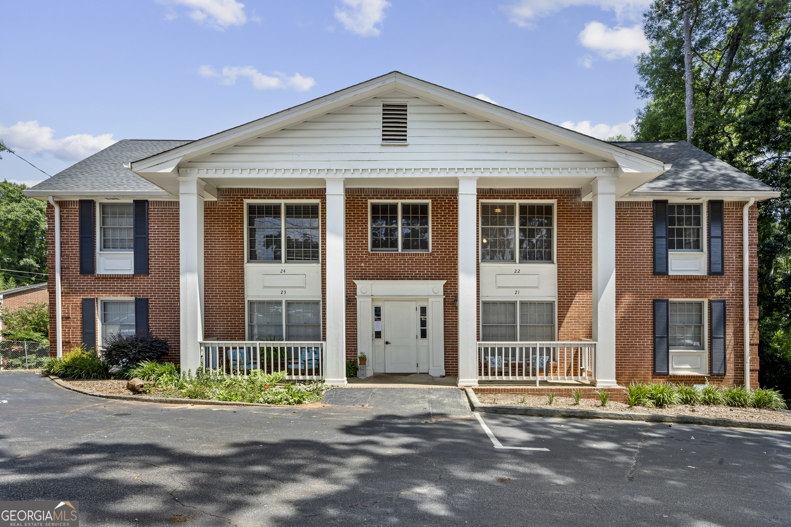 135 Hill Street, Unit 22 Decatur, GA 30030 - Photo 2 of 36 a front view of a house with a yard