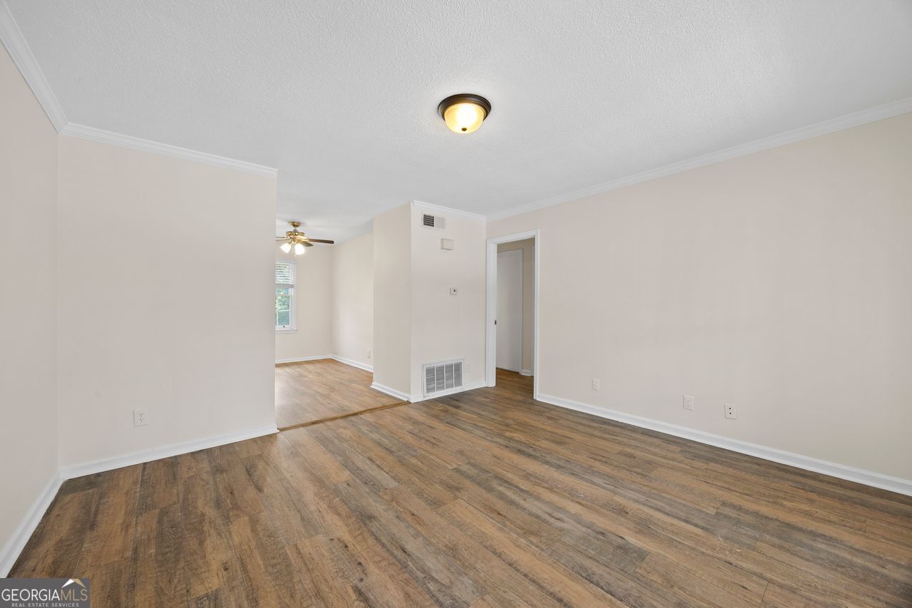 135 Hill Street, Unit 22 Decatur, GA 30030 - Photo 26 of 36 a view of an empty room and wooden floor