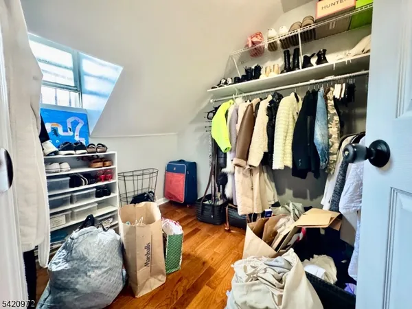 a bedroom with a bed and a mirror