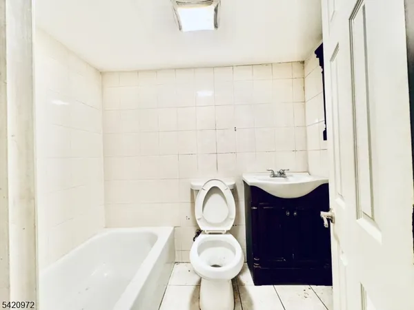 a view of a car park in front of a house