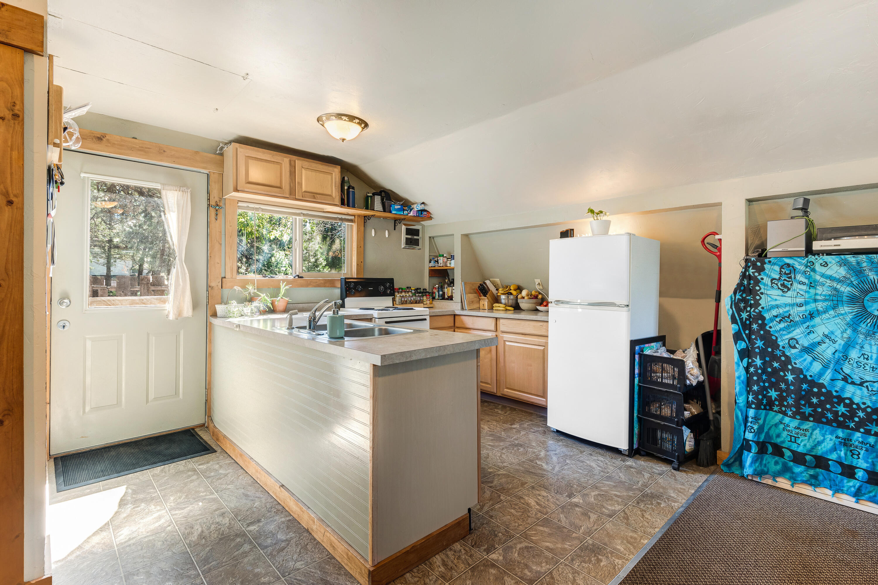 2240 Northwest Awbrey Road Bend, OR 97703 - Photo 7 of 12 a kitchen with refrigerator and cabinets