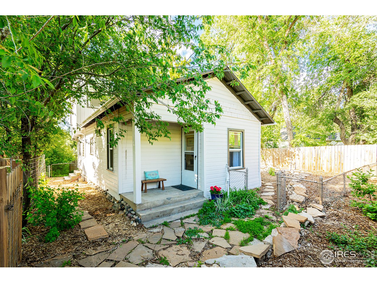 6005 Valmont Road Boulder, CO 80301 - Photo 3 of 34 a view of a house with a small yard plants and large tree
