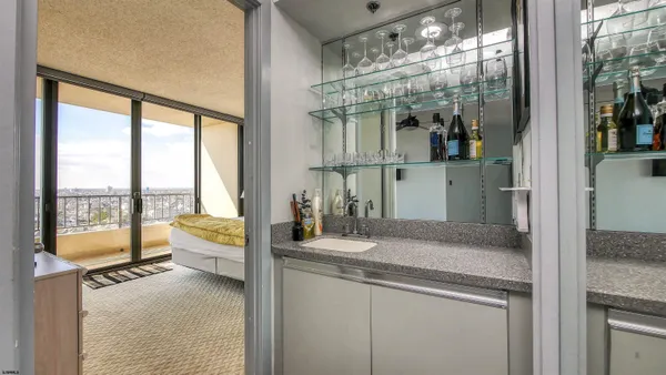 a living room with lots of furniture and a book shelf