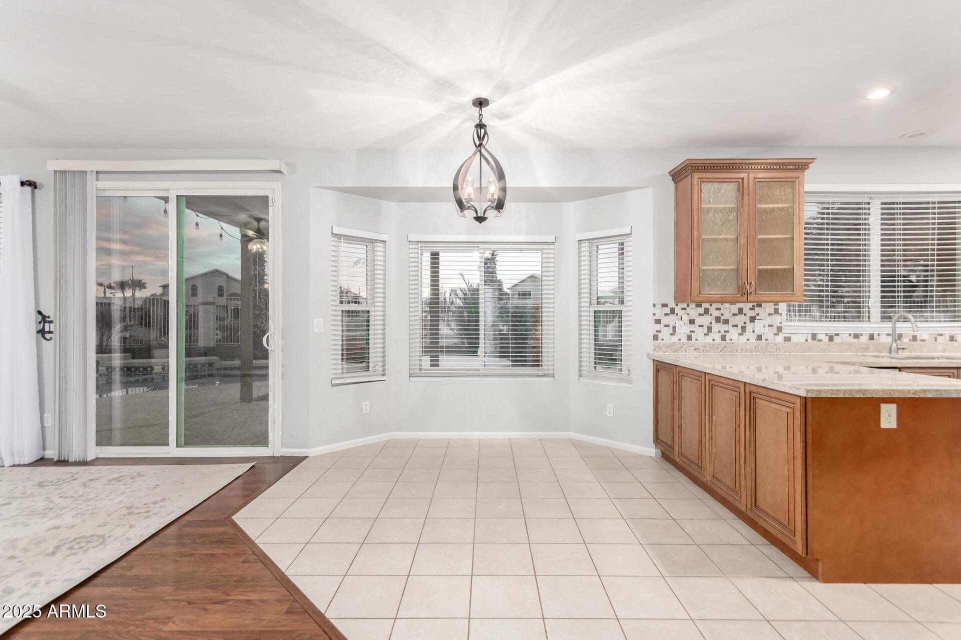 518 South Pueblo Street Gilbert, AZ 85233 - Photo 12 of 50 a large room with chandelier and windows