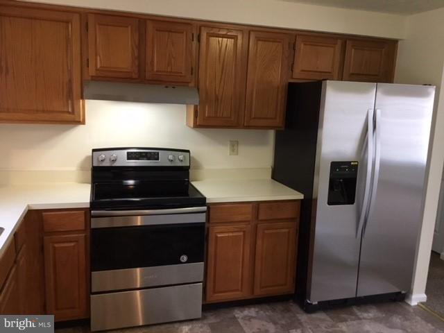 6394 Devonshire Lane Frederick, MD 21703 - Photo 2 of 30 a kitchen with appliances and cabinets