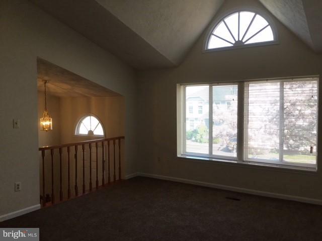 6394 Devonshire Lane Frederick, MD 21703 - Photo 11 of 30 a view of a livingroom with a floor to ceiling window and chandelier