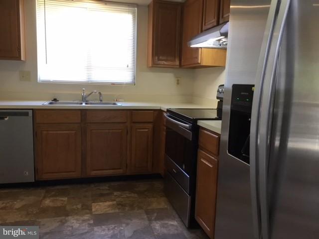 6394 Devonshire Lane Frederick, MD 21703 - Photo 3 of 30 a kitchen with stainless steel appliances granite countertop a refrigerator and a sink