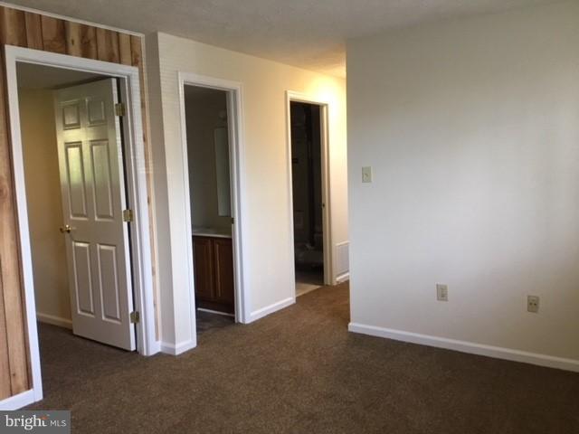 6394 Devonshire Lane Frederick, MD 21703 - Photo 23 of 30 an empty room with closet and mirrors