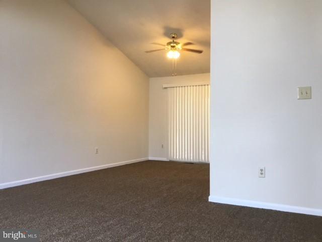 6394 Devonshire Lane Frederick, MD 21703 - Photo 6 of 30 an empty room with a chandelier fan and windows