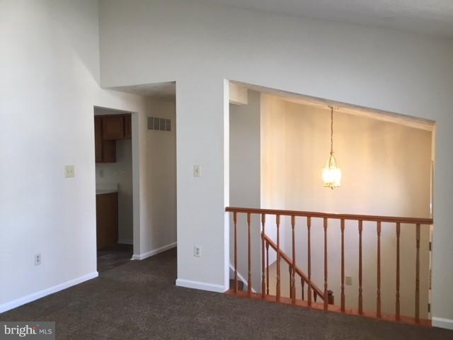 6394 Devonshire Lane Frederick, MD 21703 - Photo 8 of 30 a view of a hallway with wooden floor and entryway