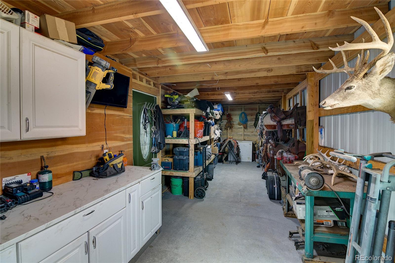 4531 East Best Road Larkspur, CO 80118 - Photo 37 of 49 a view of a storage room with a lot of stuff