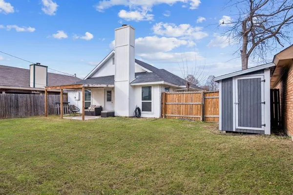 a house view with a garden space