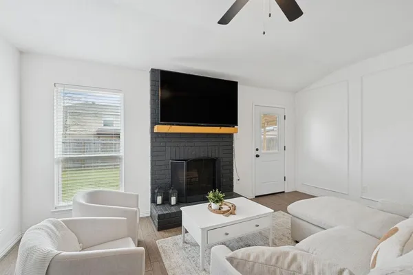 a living room with furniture and a fireplace