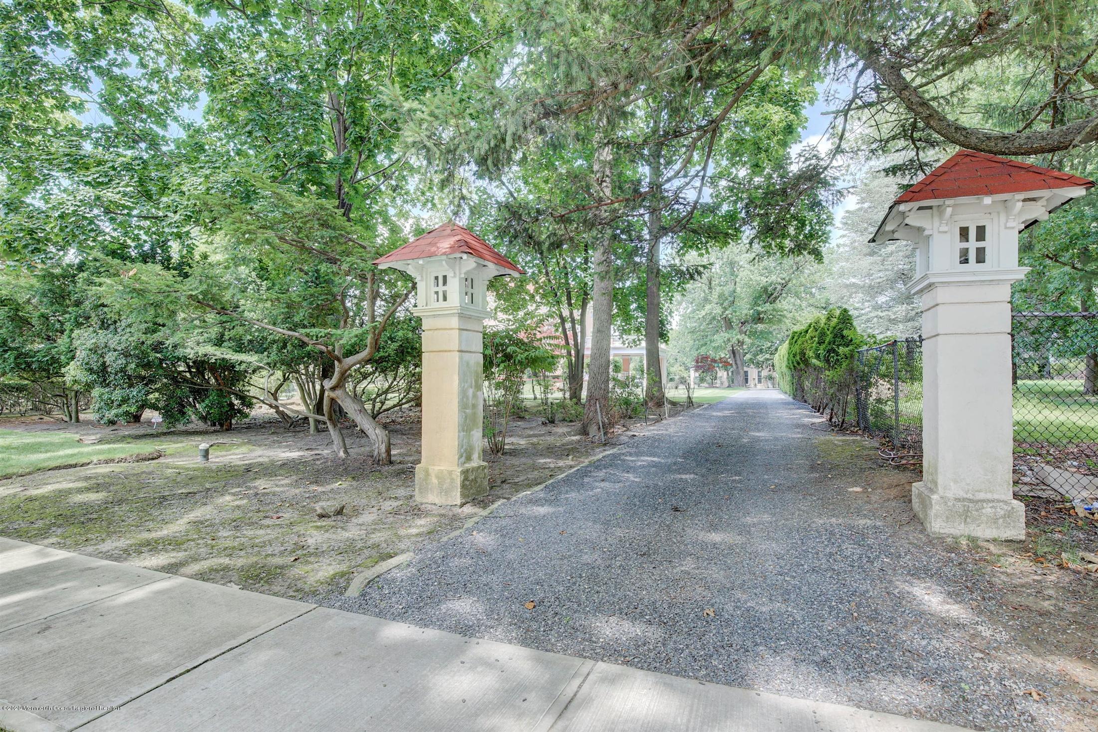 45 Runyan Avenue Deal, NJ 07723 - Photo 11 of 60 a dirt road with trees in the background