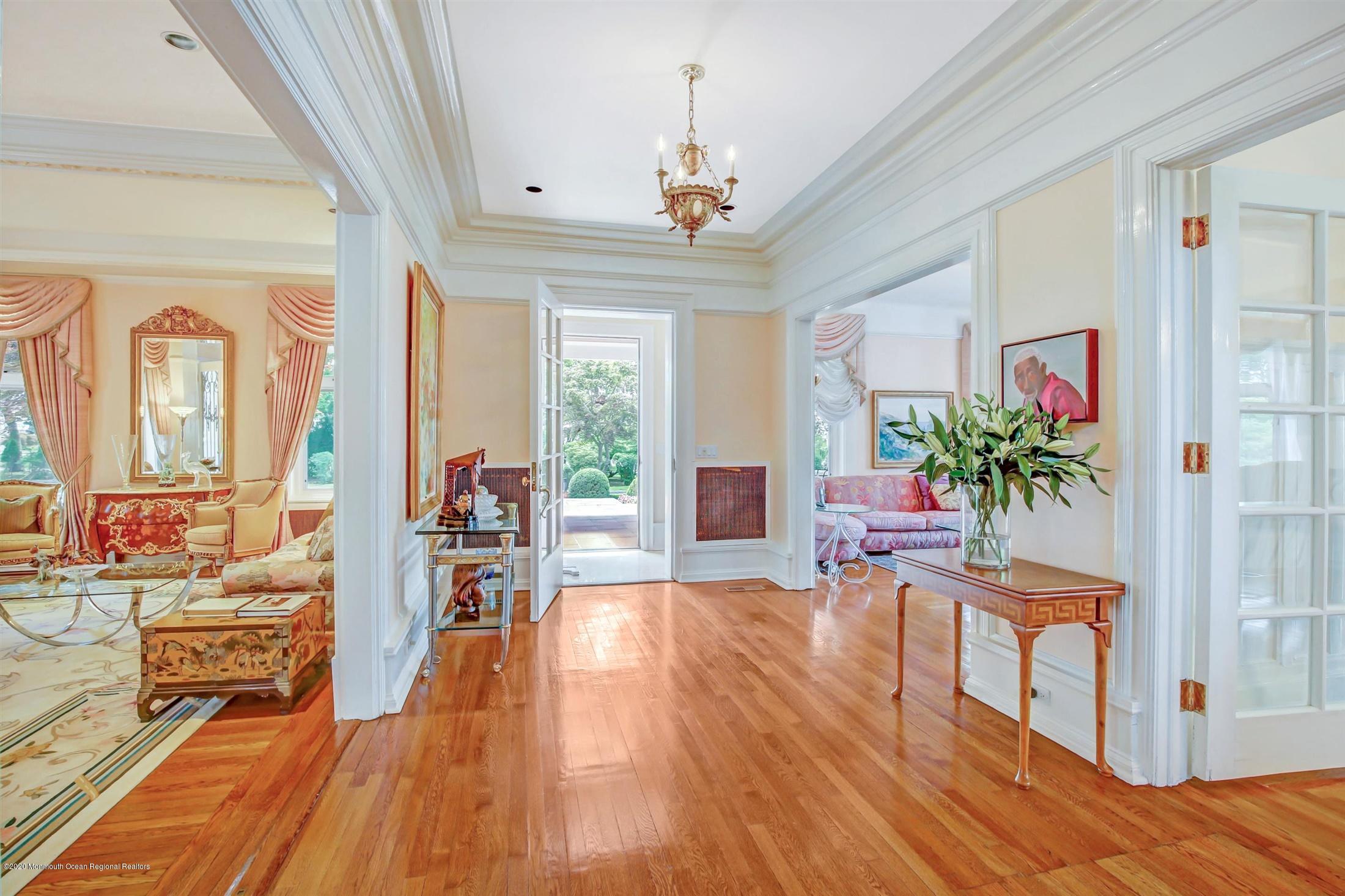 45 Runyan Avenue Deal, NJ 07723 - Photo 14 of 60 a living room with furniture and a chandelier