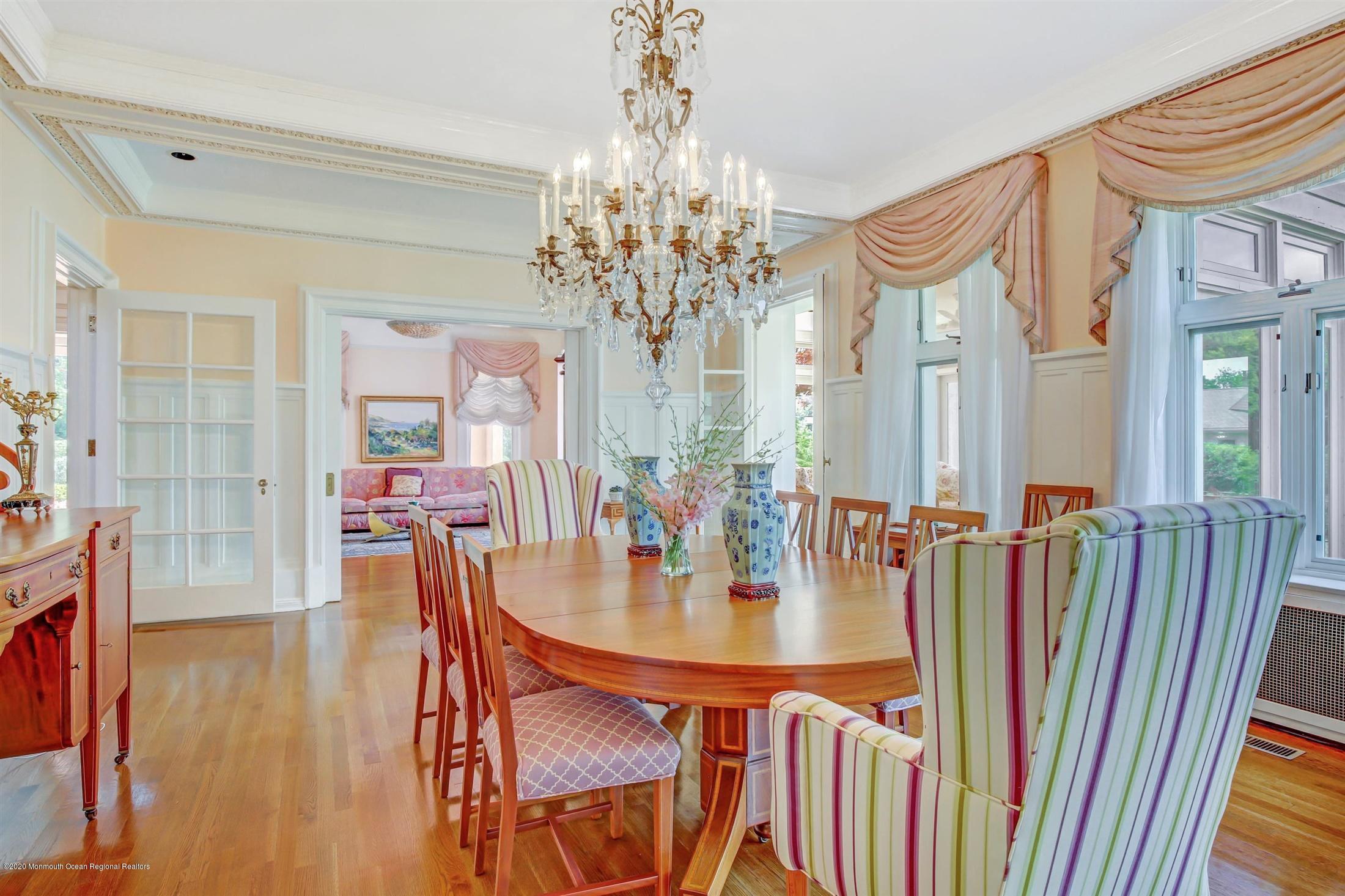 45 Runyan Avenue Deal, NJ 07723 - Photo 18 of 60 a view of a dining room with furniture and a chandelier