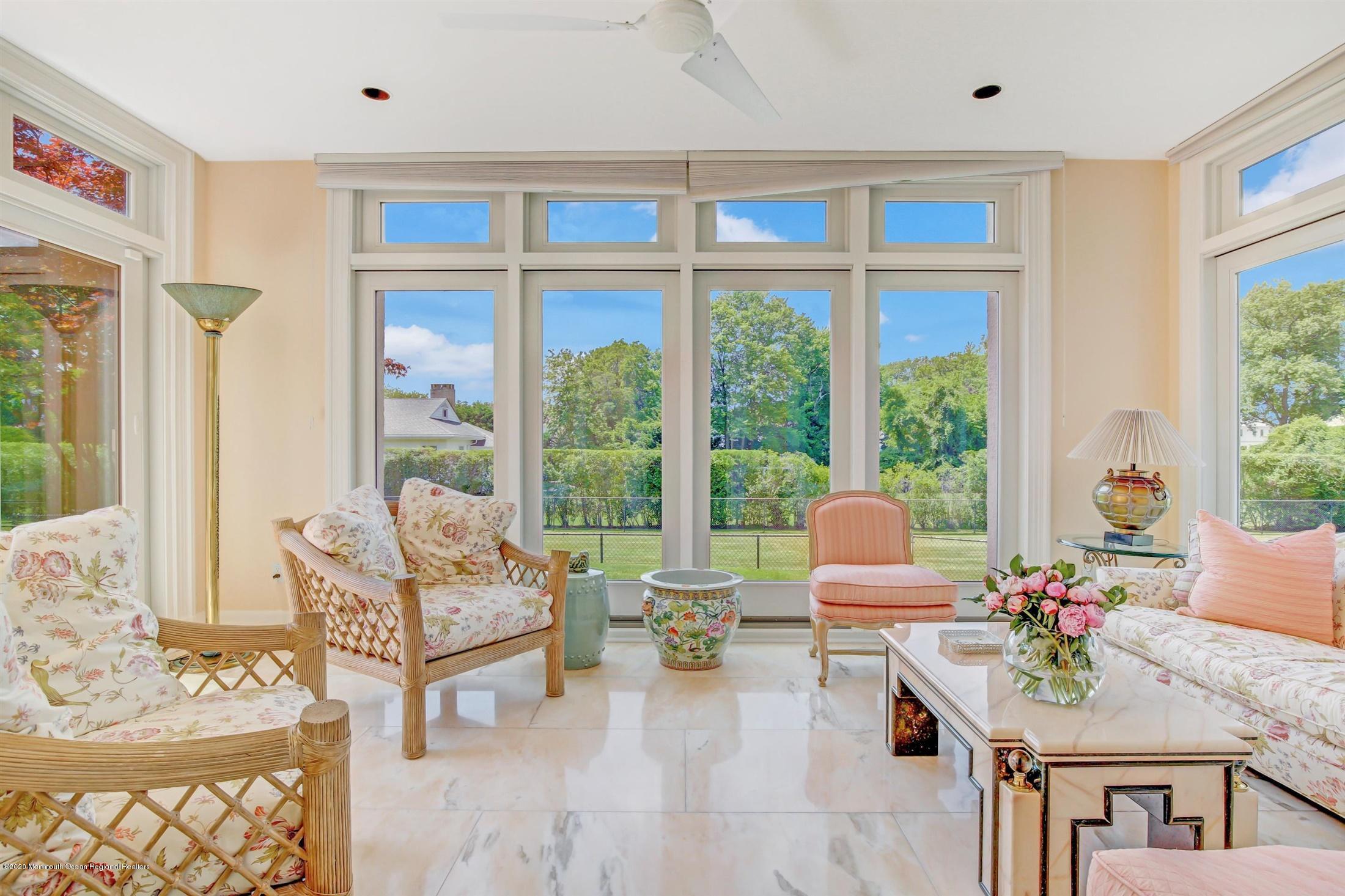 45 Runyan Avenue Deal, NJ 07723 - Photo 19 of 60 a living room with furniture and floor to ceiling windows