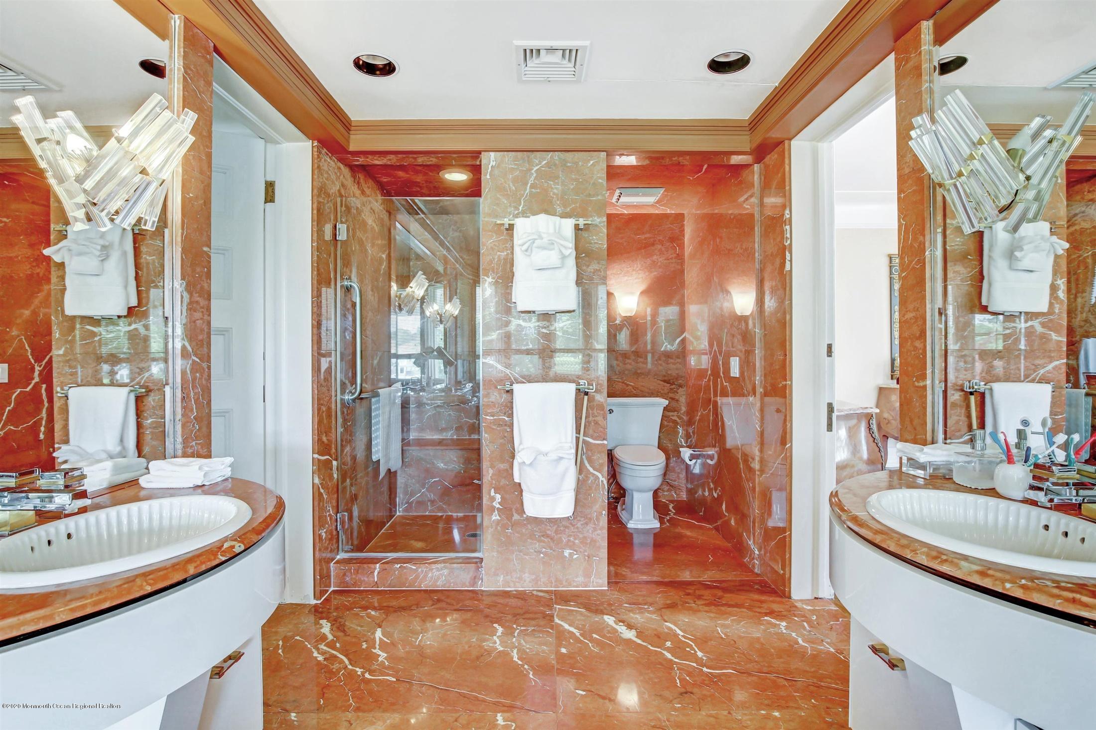 45 Runyan Avenue Deal, NJ 07723 - Photo 36 of 60 a spacious bathroom with a tub and shower