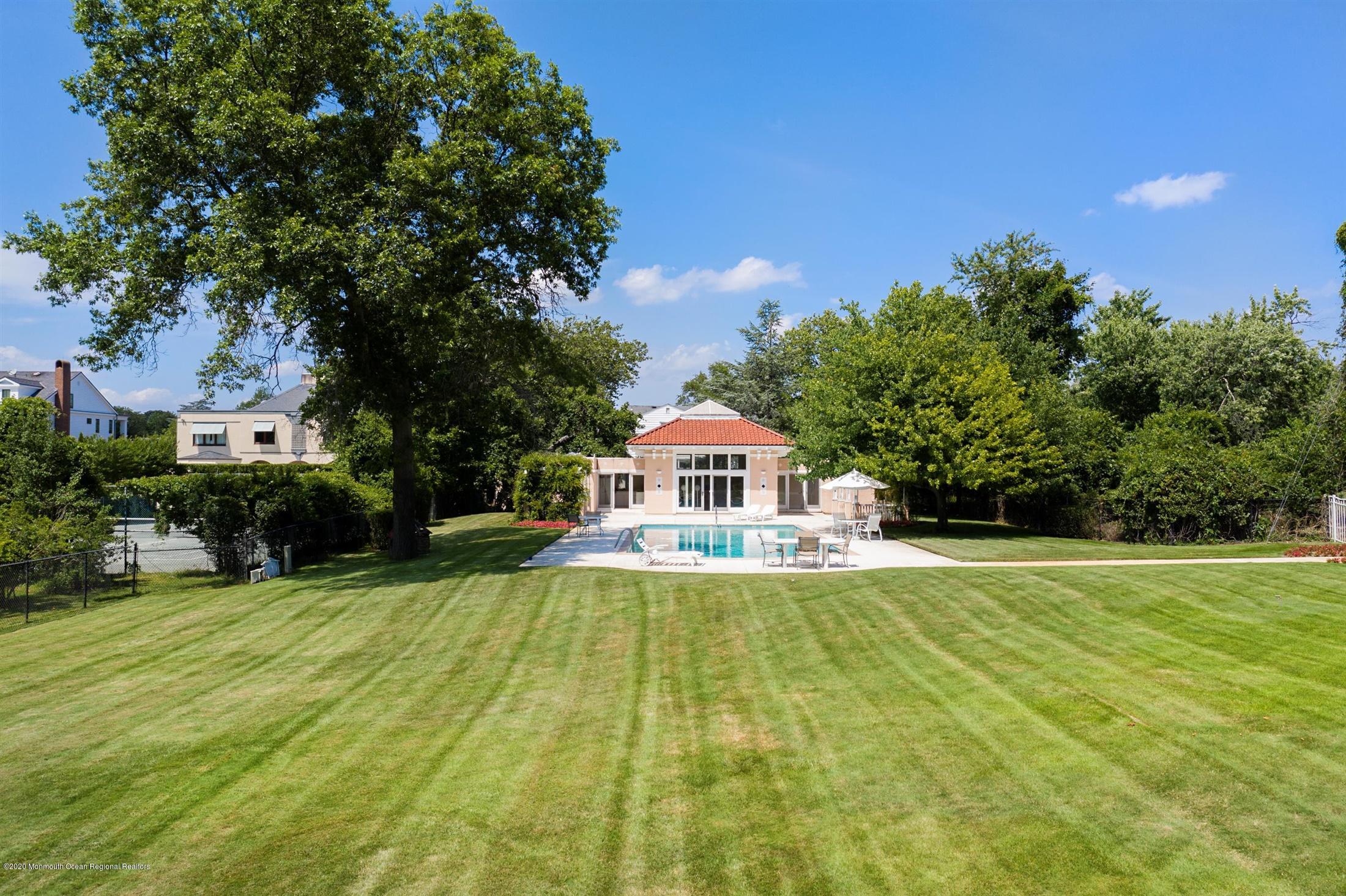 45 Runyan Avenue Deal, NJ 07723 - Photo 57 of 60 a view of a house with a yard