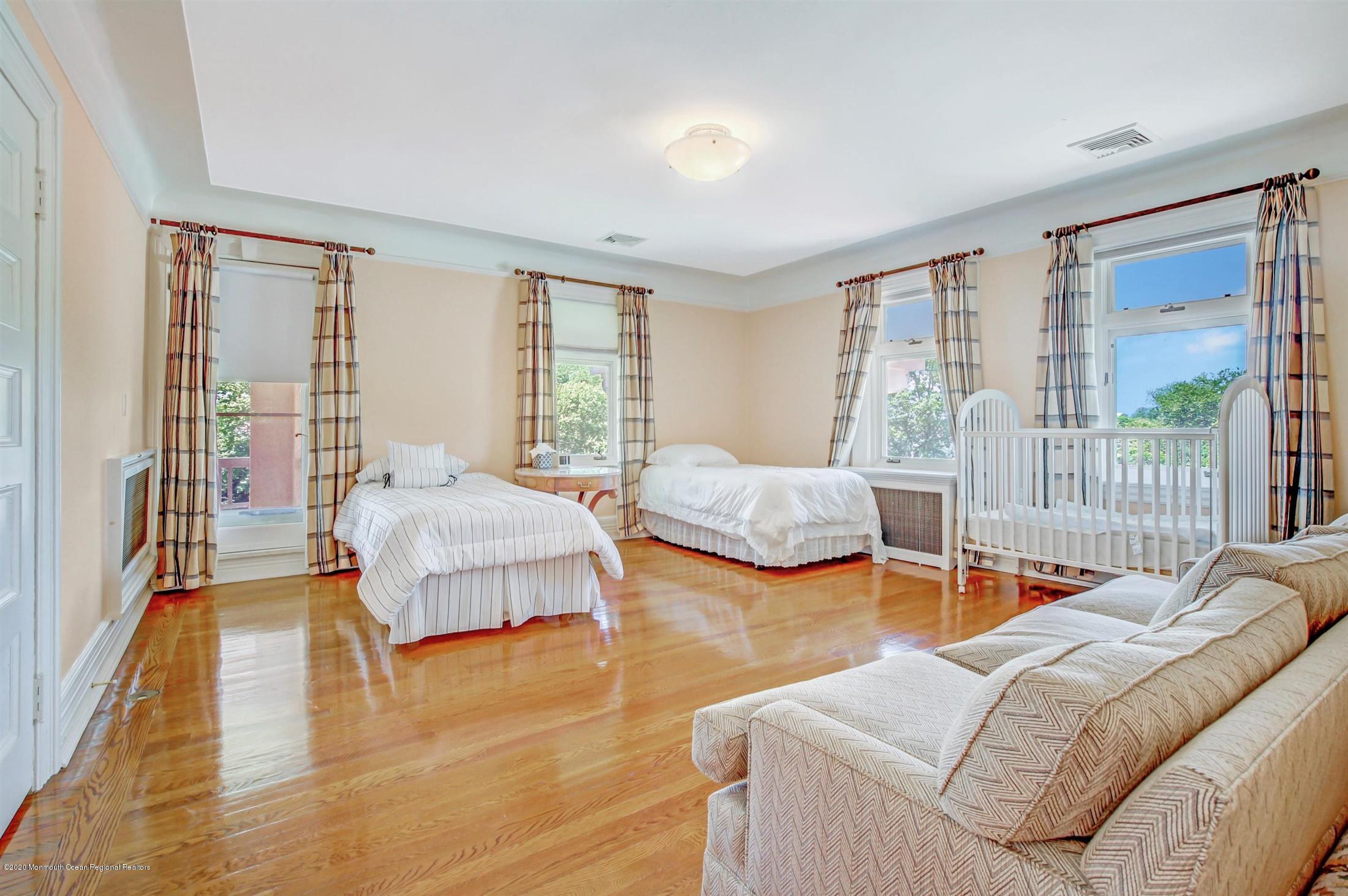 45 Runyan Avenue Deal, NJ 07723 - Photo 6 of 60 a bedroom with two beds and a large window