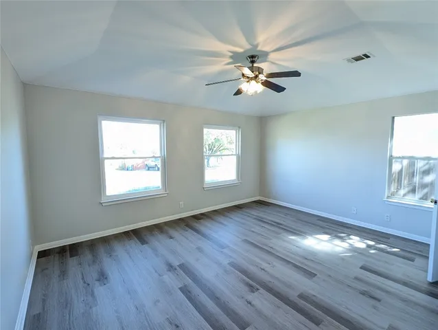 a kitchen with stainless steel appliances granite countertop a refrigerator stove and sink