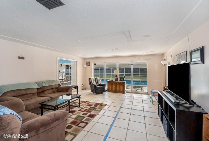 1145 St George Road Merritt Island, FL 32952 - Photo 6 of 11 05_1145SAINTGEORGEROAD_3001_FamilyRoom_F