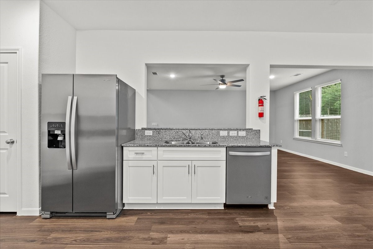 10243 Gates Ml Road Houston, TX 77034 - Photo 13 of 32 View of Kitchen towards the Living Room showing the Refrigerator staying with the home.