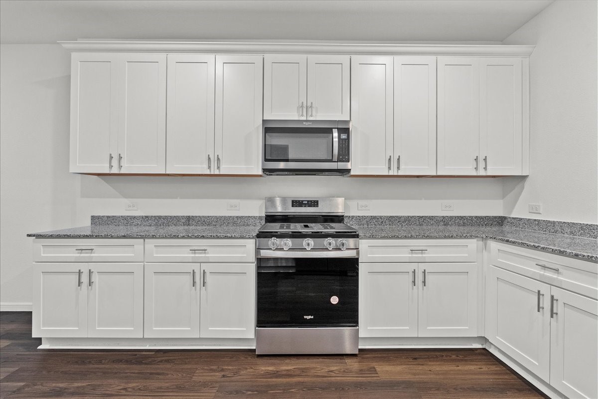 10243 Gates Ml Road Houston, TX 77034 - Photo 15 of 32 Another view of the Kitchen showing so many cabinets, the oven, cooktop, and microwave