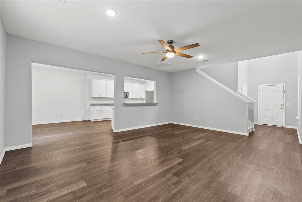 10243 Gates Ml Road Houston, TX 77034 - Photo 7 of 32 Another view of living room showing the dining room, kitchen, and entry way.